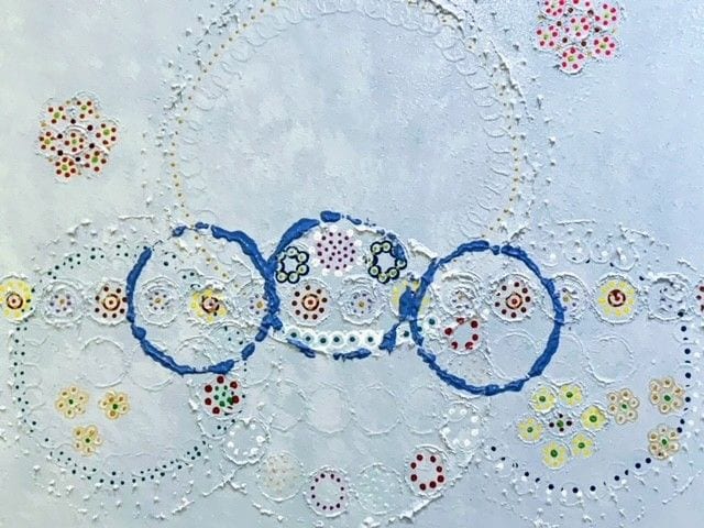 A close up of the olympic rings on a table